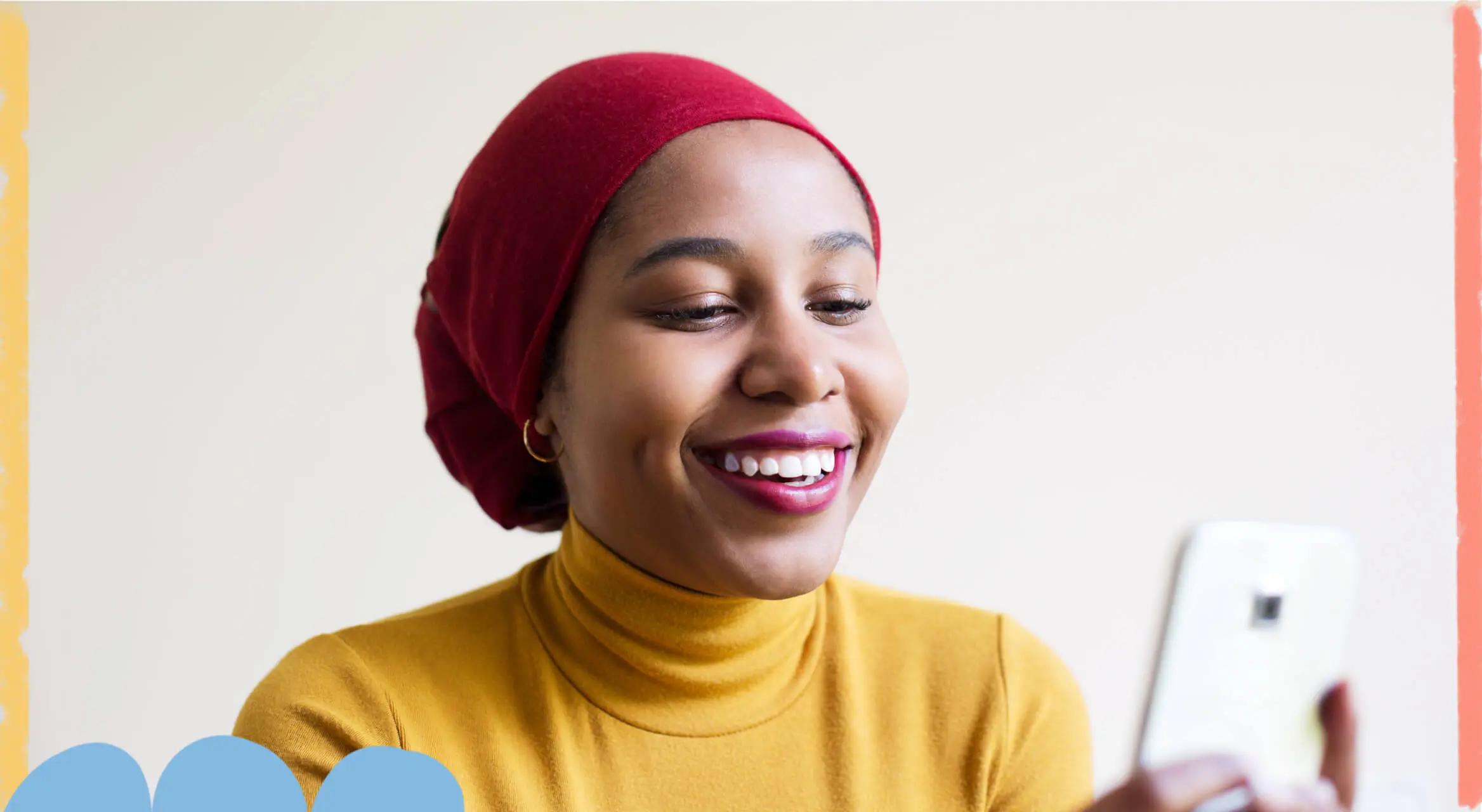 Woman smiling while using phone